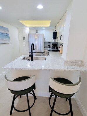 Fridge, microwave, oven, stovetop - BEACH FRONT w/ ROOFTOP DECK! - {Barbados 1} Newly Renovated 1 BR / 1.5 BA - Walk to Times Square! (Fort Myers Beach)