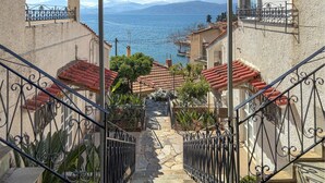 A staircase leading to a terrace with a view of the sea and mountains. - 1 bedroom amazing apartment in Nafpaktos (Nafpaktos)