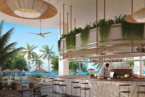 A bar area with a view of the ocean, bar stools, and a bartender.