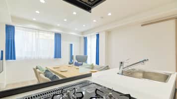 Apartment | Private kitchen | Fridge, microwave, stovetop, cookware/dishes/utensils