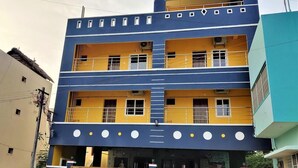 A multi-story building with balconies, windows, and a flat roof. - Jayam Residency (Tiruvannamalai)