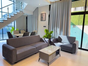 32-inch flat-screen TV with cable channels - The White Casa Villa (Devghar)