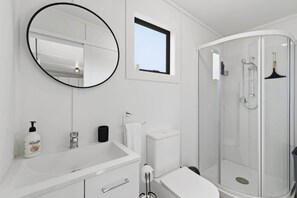 Shower, hair dryer, towels, shampoo