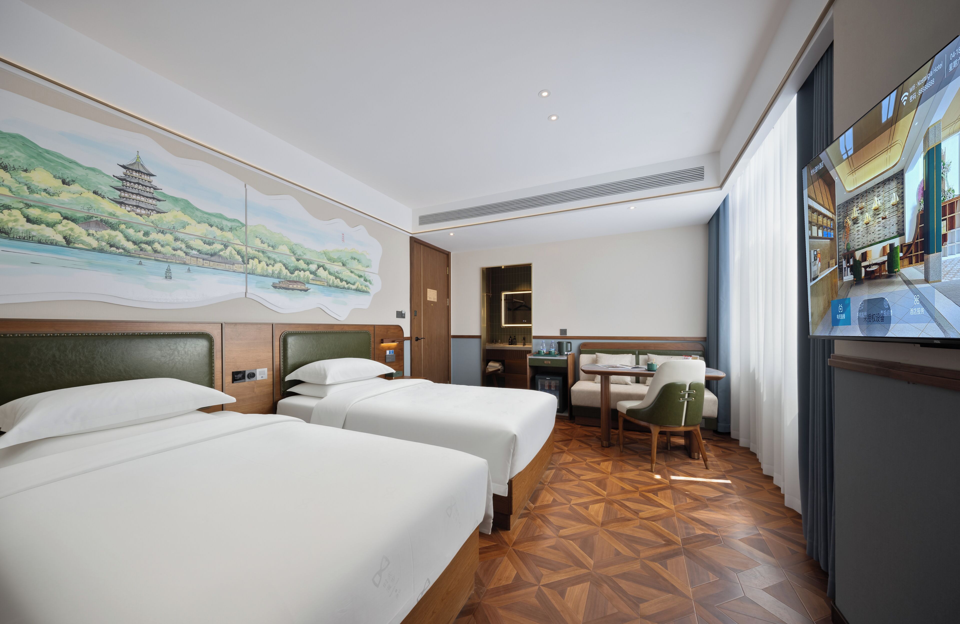 A hotel room with two beds, a desk, a chair, and a large window.