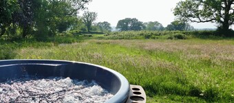 Large luxury shepherd's hut with hot tub in the stunning Welsh countryside.