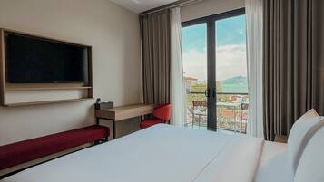 Premium Double Room, Balcony, Partial Ocean View | Free WiFi, bed sheets