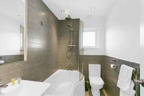 Shower, hair dryer, towels, shampoo