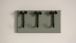 A wall-mounted object with three black, spiral-shaped components. - Hotel Indigo Cardiff (Cardiff)