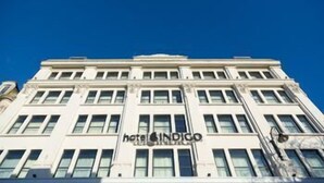 A multi-story hotel building with a classic architectural style, featuring a central entrance and large windows. - Hotel Indigo Cardiff (Cardiff)