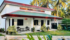 A two-story building with a red roof and white walls, labeled 'KOKO VILLA.' - KOKO Villa (Negombo)