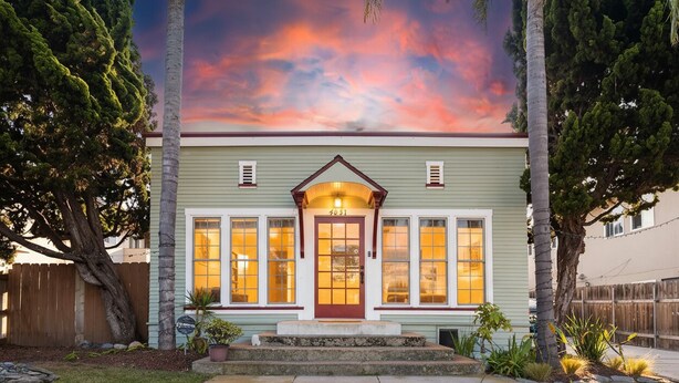 A two-story house with a front porch, a mailbox, and a well-maintained lawn. - Ocean Beach House 3BR, Parking, Large Patio, Firepit, Grill and 2 blocks from the beach (San Diego)