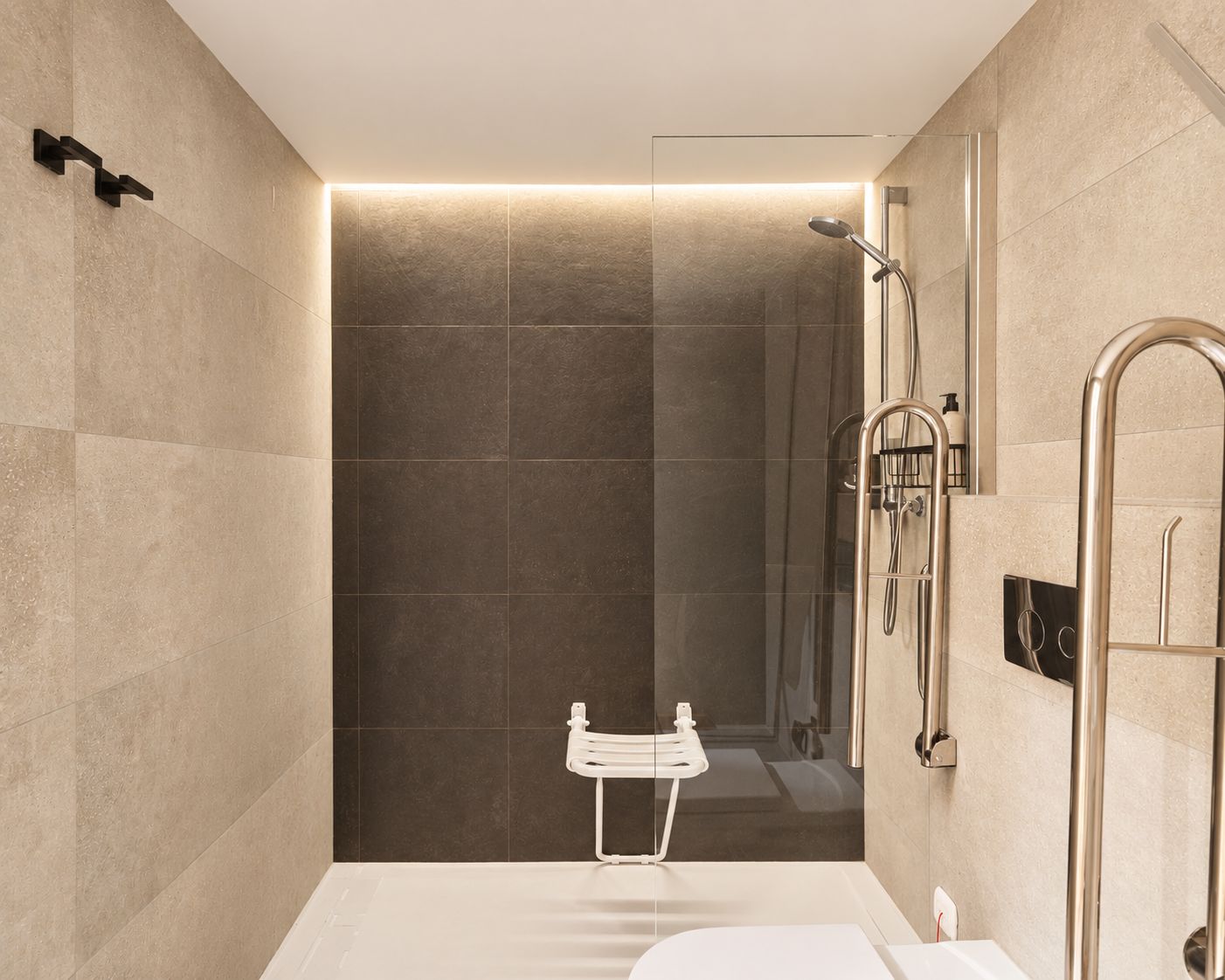 A modern bathroom with a shower, a white sink, and a glass-enclosed shower area.