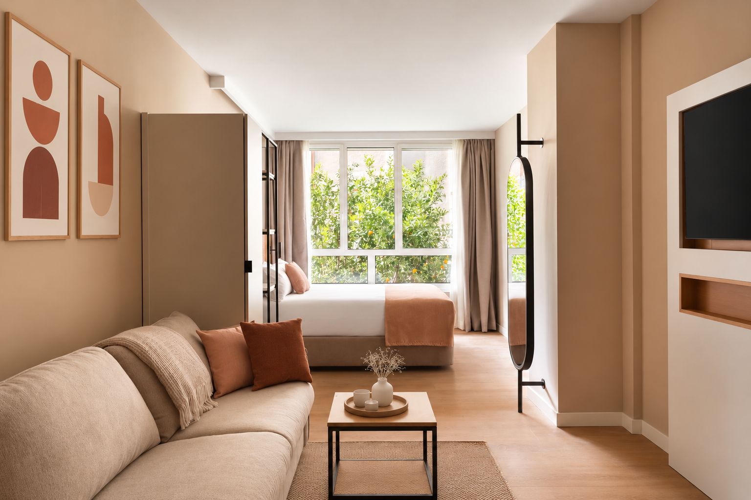 A modern living room with a sofa, a coffee table, and a view of a balcony with plants.