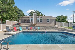 Pool - Welcome to your luxury Lee’s Summit getaway—a high-end 4-bedroom, 3-bath home designed for comfortable group stays with a true “vacation mode” backyard. (Lees Summit)