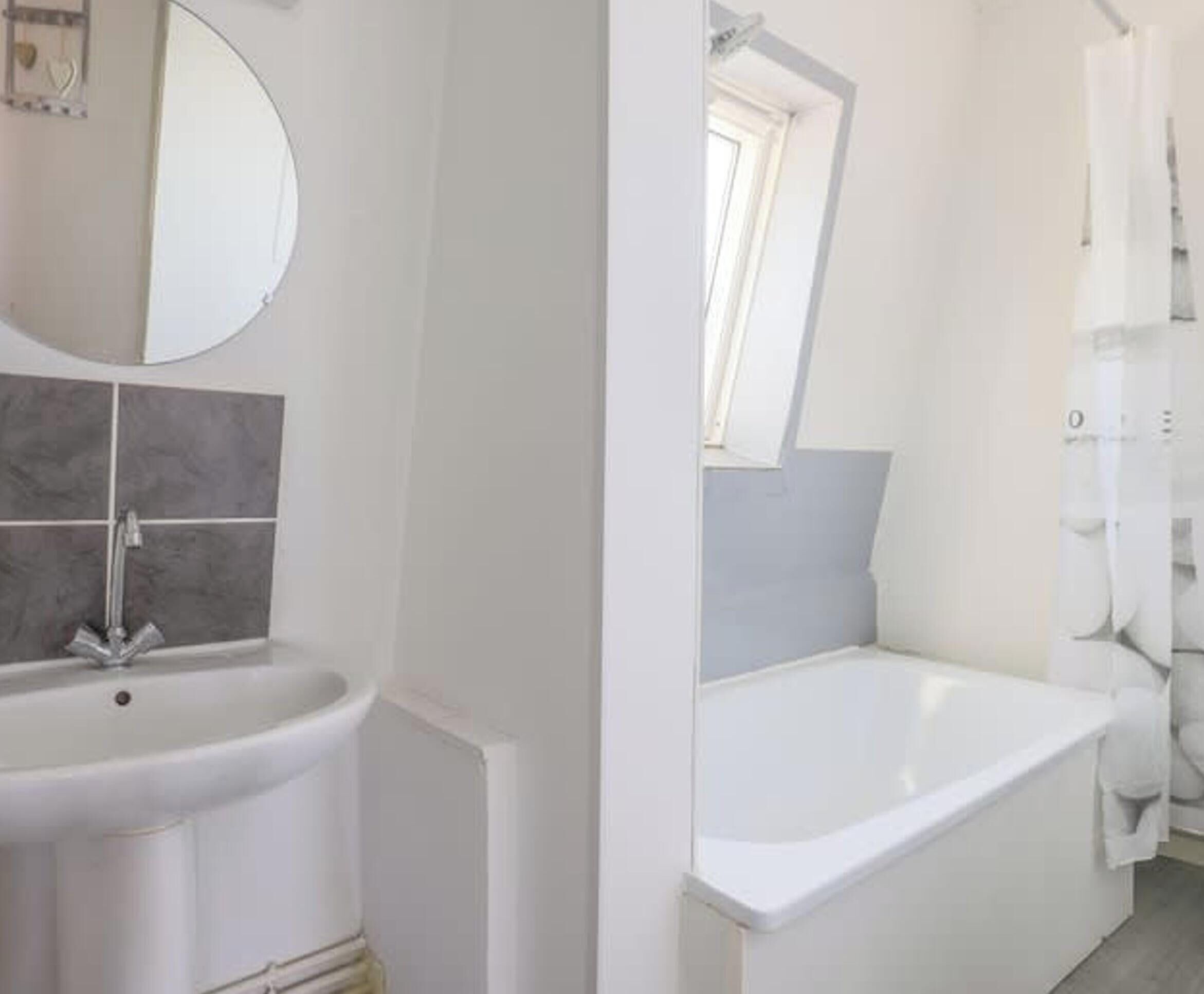 A bathroom with a sink, mirror, and bathtub.