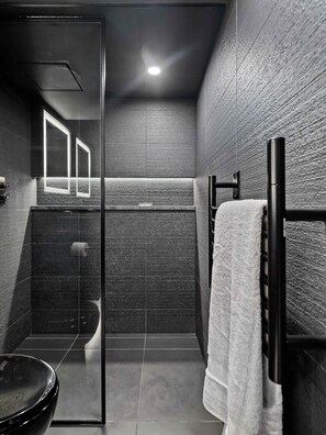 Shower, hair dryer, towels, shampoo