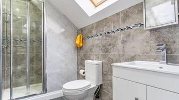 Shower, hair dryer, towels, shampoo