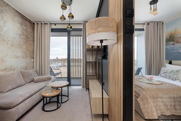 The living room's modern and stylish decor creates a welcoming atmosphere.