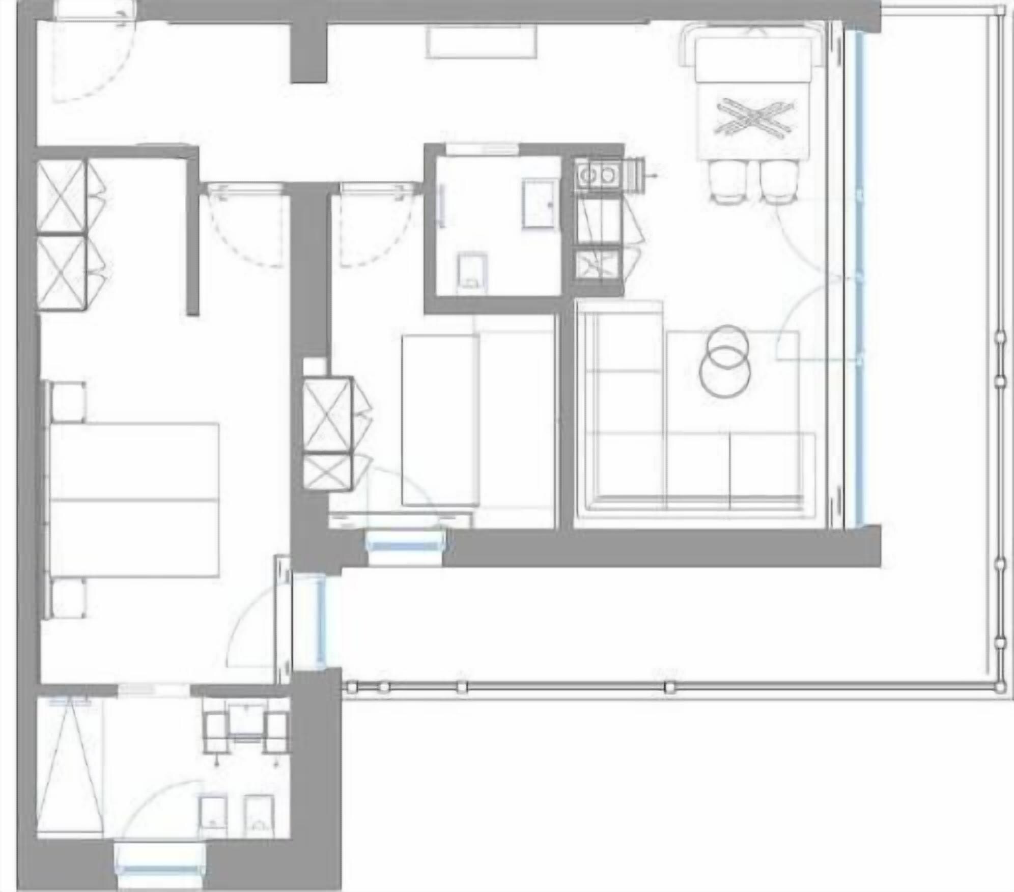A floor plan with a kitchen, dining area, two bedrooms, a bathroom, and a living room.