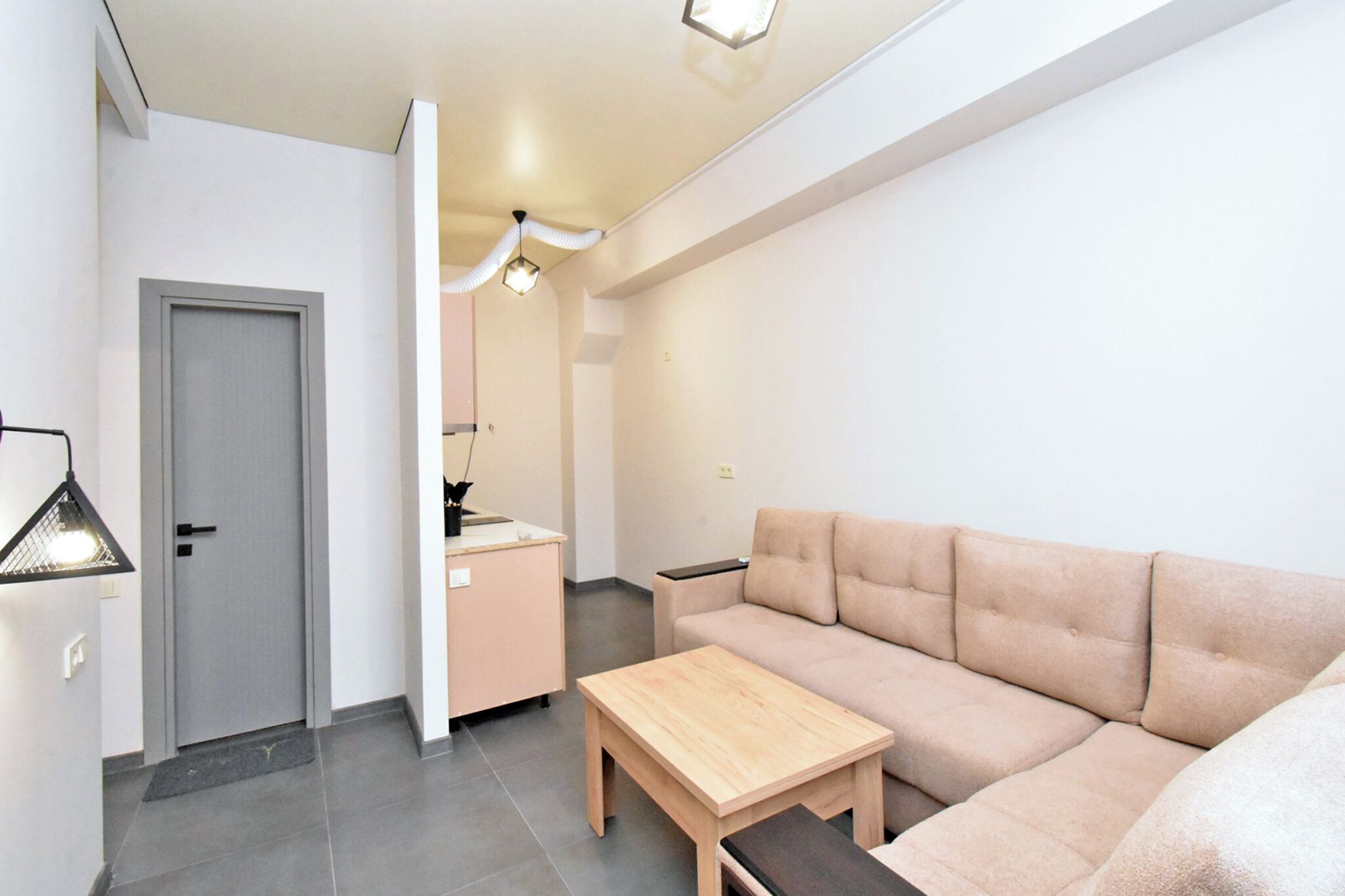 Family Apartment, Courtyard View | Living area | 75-cm flat-screen TV with digital channels