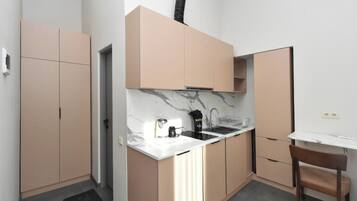 Deluxe Apartment, Courtyard View | Private kitchen | Coffee/tea maker, fridge, microwave (on request), stovetop
