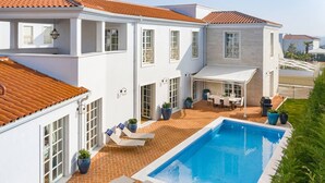 A two-story house with a swimming pool, outdoor seating, and a covered patio area. - Villa Fiordaliso – Luxury villa for up to 6 guests with private pool in peaceful Mediterranean surroundings. (Vabriga)