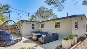 A patio with outdoor seating, a hot tub, and planters. - Pensacola Retreat: Near Fall Festivals & Events (Gulf Breeze)