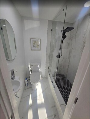 Shower, hair dryer, towels, soap