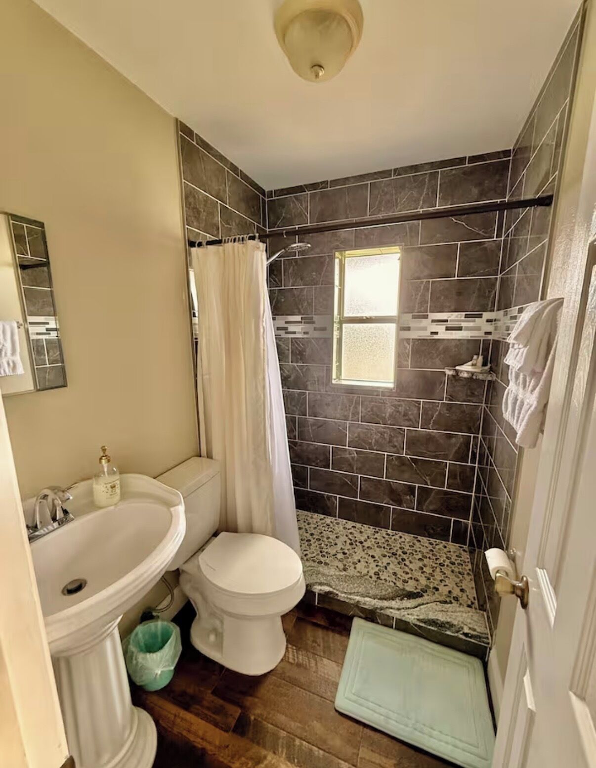 Shower, towels, soap, toilet paper