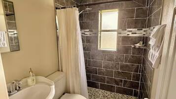 Shower, towels, soap, toilet paper