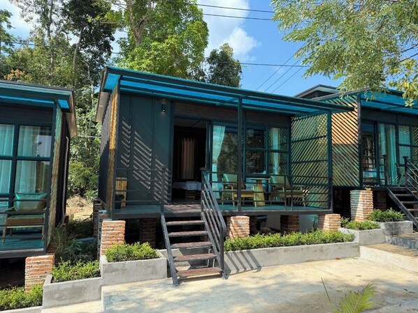 A modern building with a staircase leading to a covered outdoor area. - Sand & Sun Koh Rong (Koh Rong)