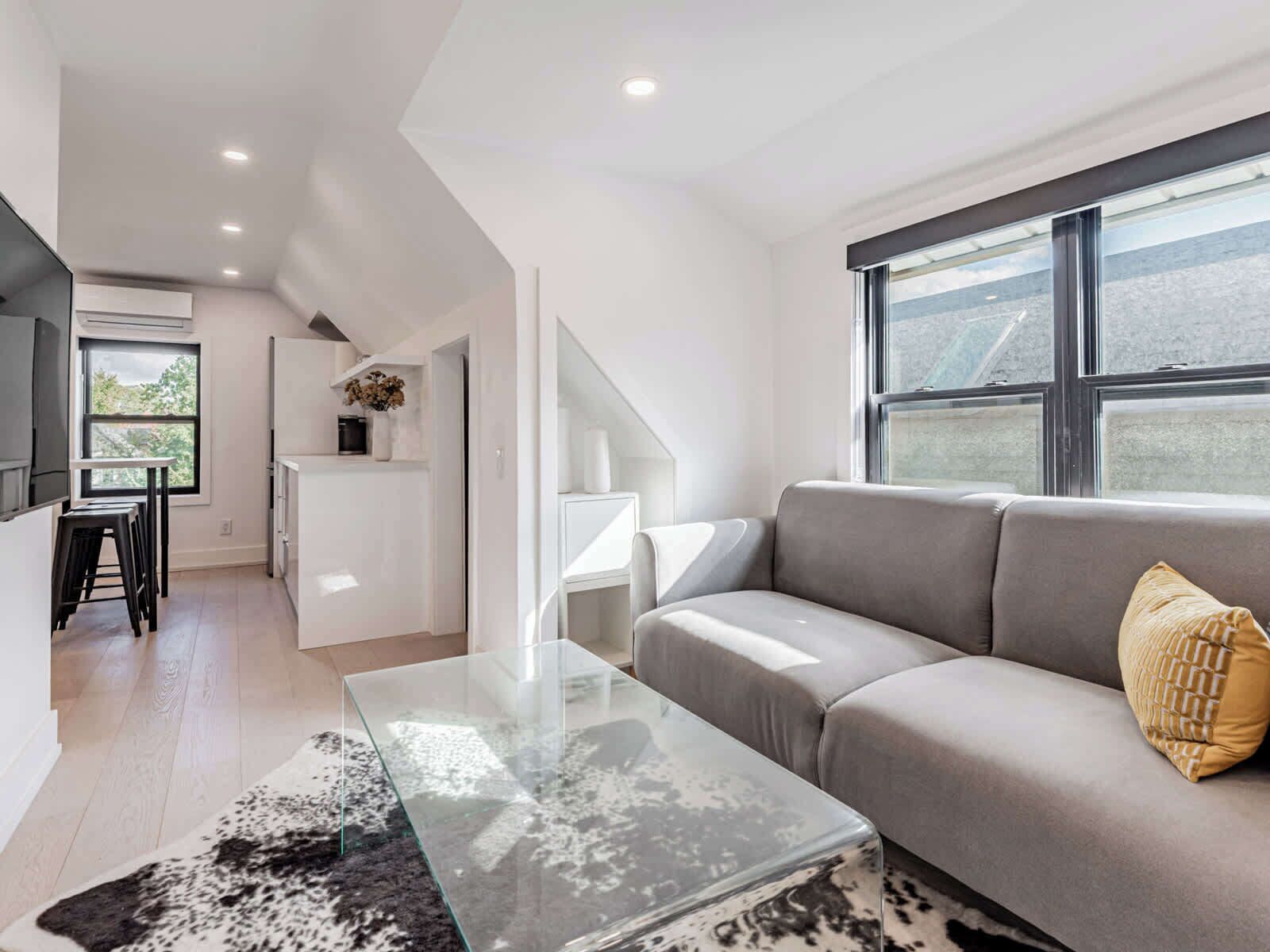 Bright, modern lounge with cozy seating and stylish decor.