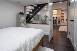 Rest easy in cozy bedrooms with hotel-quality linens and queen beds. - Modern 3BR Basement Retreat w/ Workspace & Parking (Toronto)