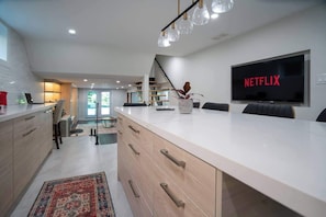 Spacious dining area perfect for meals and gatherings. - Modern 3BR Basement Retreat w/ Workspace & Parking (Toronto)