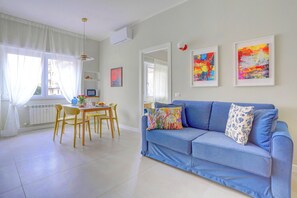 Comfort Apartment | Living area | 40-inch Smart TV with digital channels - San Giovanni Appia Park Modern Apartment with Balcony Metro A 10 Min City Center (Rome)