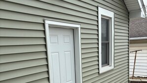 A house with a white door, a window, and a doormat with 'HELLO' on it. - Modern 2 Bed 1 Bath Friendly Morningside Area (Sioux city)
