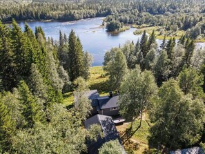 A house surrounded by dense forest and a river. - 6 Person Holiday Home in Duved (Duved)