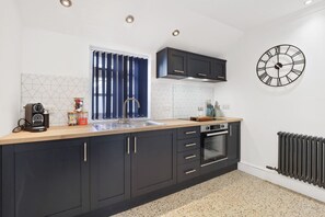 Fridge, oven, coffee/tea maker, toaster