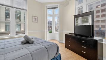 1 bedroom, desk, iron/ironing board, travel crib