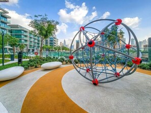 Children’s area - City Living 1BR Near Coca-Cola Arena and Park, Few Minutes Walk to the Metro (Dubai)