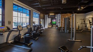 A gym with treadmills, elliptical machines, and weightlifting equipment. - Modern Mins To "Atrium & Novant" Uptown Char Airport (Charlotte)