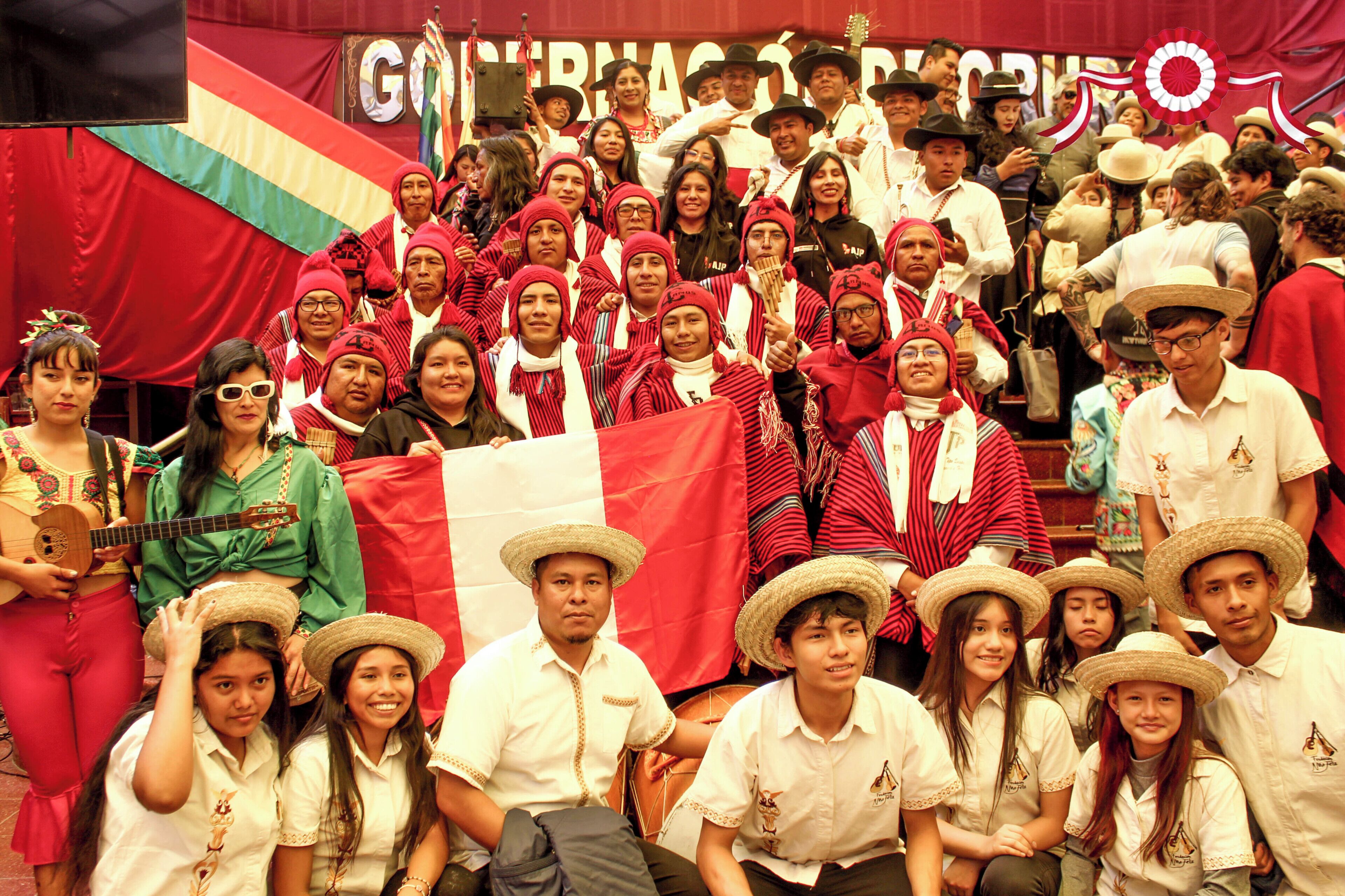 A group of people in traditional attire posing for a photo.