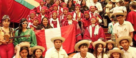 A group of people in traditional attire posing for a photo.