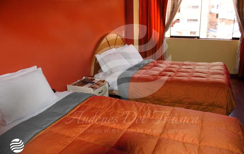 A hotel room with two beds, a nightstand, and a window with curtains.