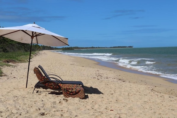 On the beach, white sand, free beach cabanas, sun loungers