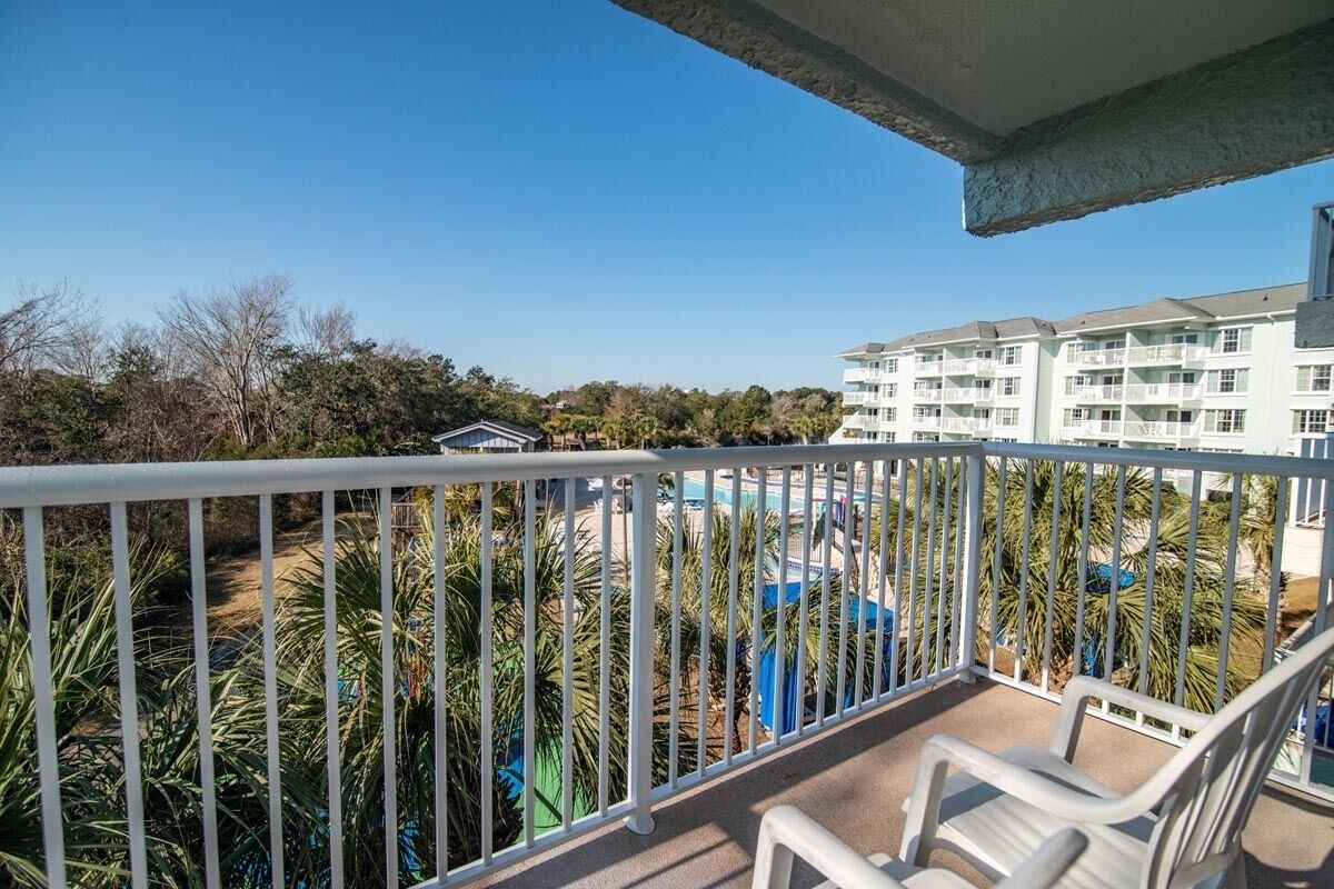 Sip morning coffee on the balcony overlooking the resort scenery.