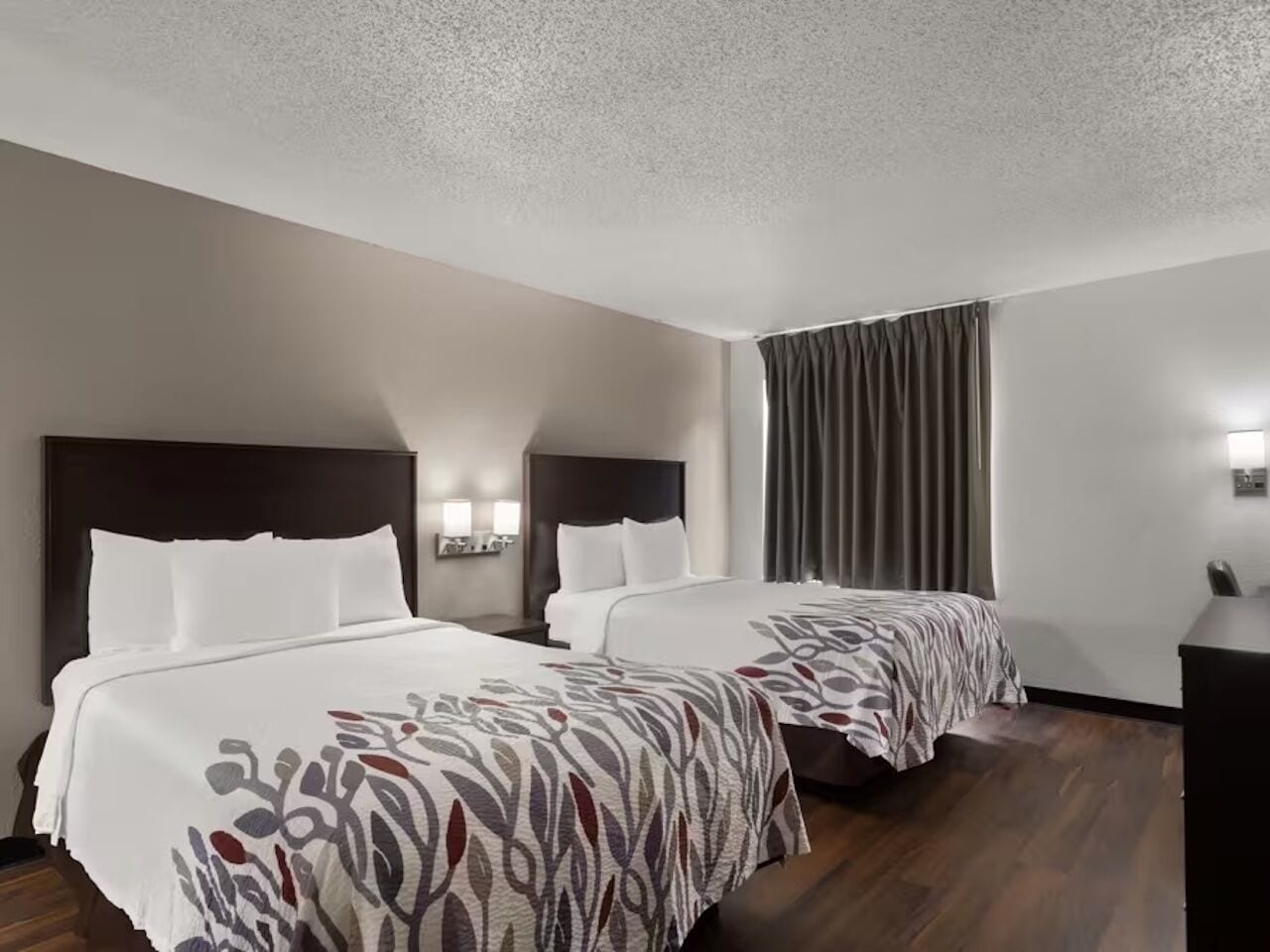 Unwind together in two plush beds after busy days