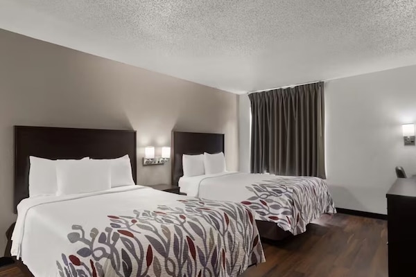 Unwind together in two plush beds after busy days