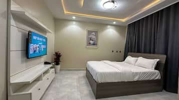 Economy Apartment, Balcony, City View | In-room safe, desk, laptop workspace, blackout drapes