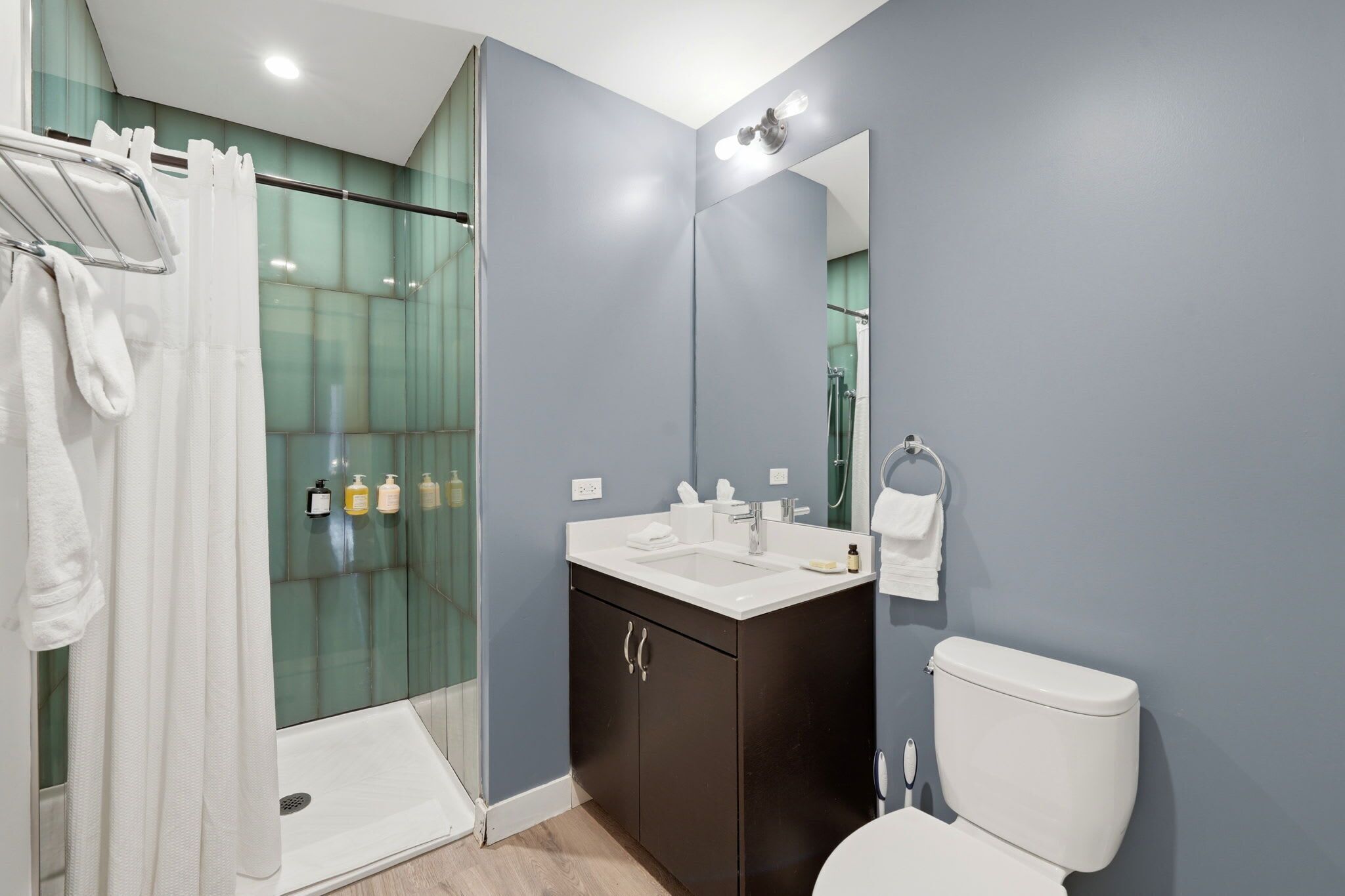 Shower, hair dryer, towels, shampoo